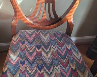 One of six upholstered drop-seat dining chairs