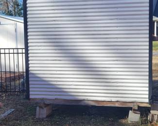 Leonard all metal shed with metal seamless roof and a double door