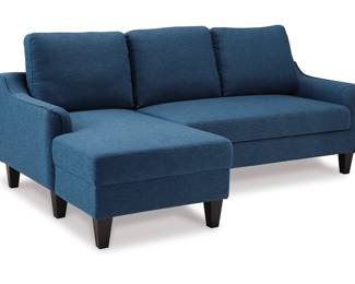 This awesome sofa has its original tag on it, and it unfolds to become a guest bed