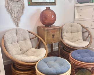 Rattan cushioned chairs with foot rests