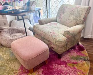 Vibrant round rug and armchair