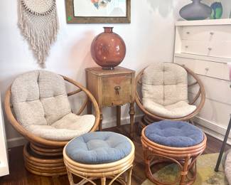 Rattan cushioned chairs with foot rests