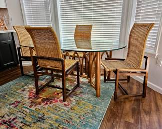 Glass top bamboo dining table with 4 chairs. Mid-century modern Cane and Walnut Chairs. Set of 4. Beautiful condition. 