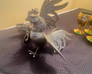 This is a pair of vintage brass fighting rooster figurines.