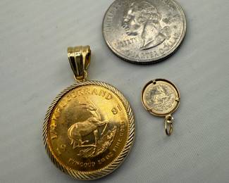 1/4 Oz & 1/10oz gold Krugerrand in 14kt pendant. 