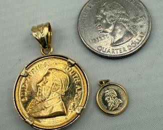 1/4 Oz & 1/10oz gold Krugerrand in 14kt pendant. 