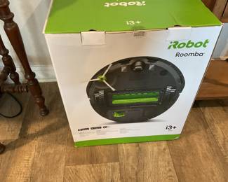 Roomba Robot vacuum cleaner with docking station.