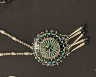 And matching needlepoint and silver necklace