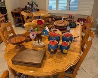 Dining table with some hand carved bowls on top