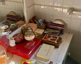 Vintage make makeup and perfume sets by Estée Lauder, Mary Kay, miniature perfume, bottles, vintage, first aid kits, and more. 