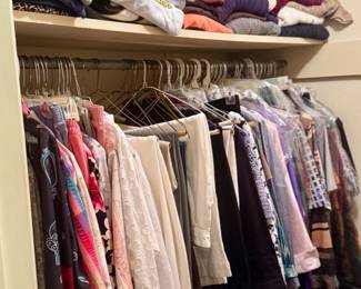 Full double-sided closet of women’s clothes, including summer and winter wear. There are so many clothes, if you bought all of them you wouldn't have to do laundry for 6 months at least. 