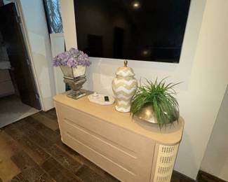 $500 for the tv, $50 foe each accessory, $750 for the dresser