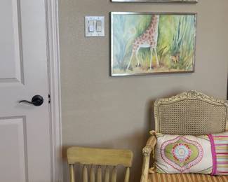 Giraffe themed art and antique chairs