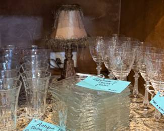 Antique etched glass collection of glassware and dessert plates. Daisy pattern glasses.