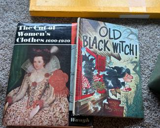 The cut of woman's clothes, Old black Witch book