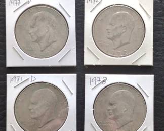 Lot # : 218a - Four Eisenhower Dollar coins in holders.
