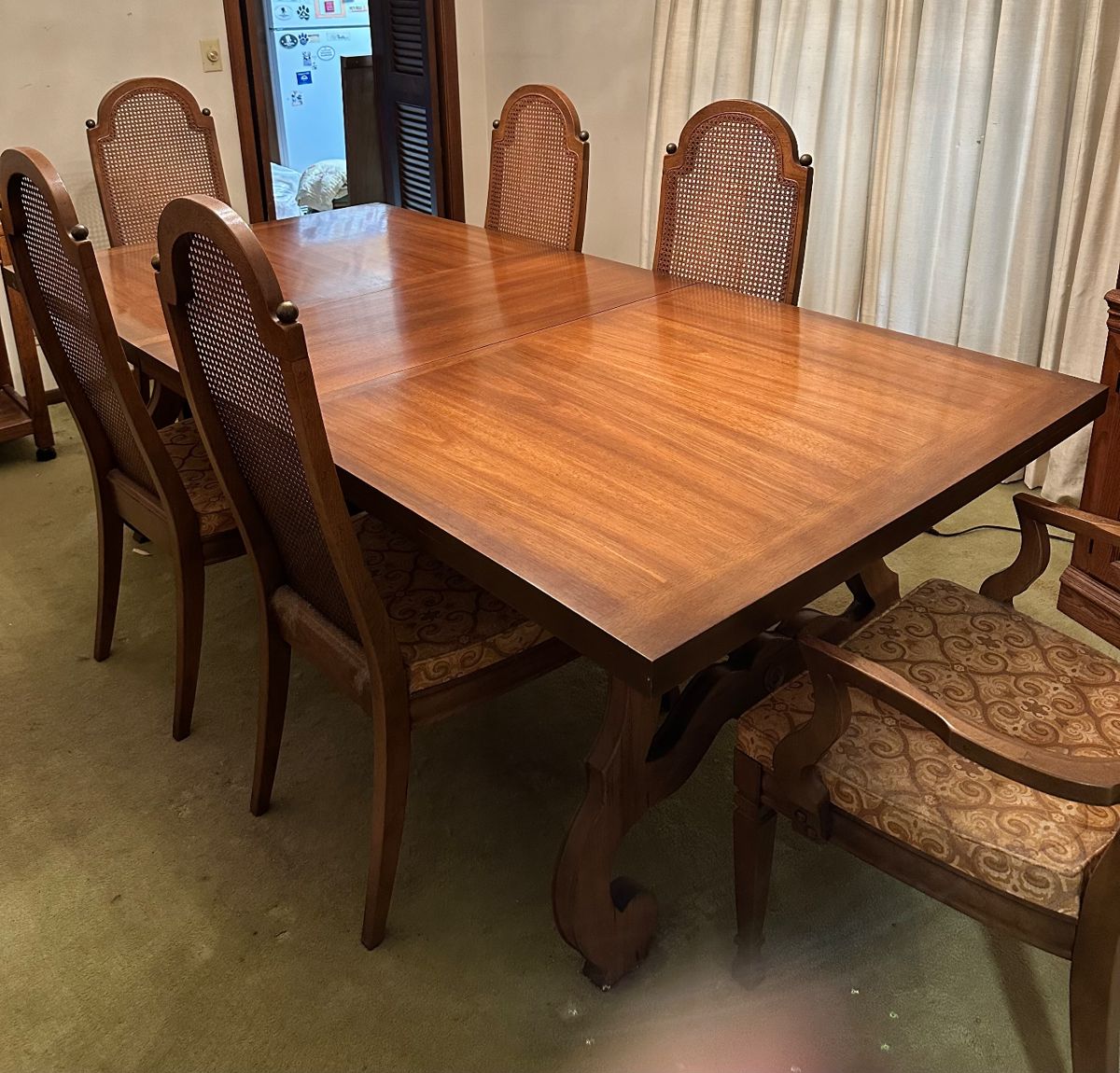 Dining room table with cane back chairs
