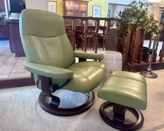 One of two Stressless (Norway) swivel recliners with footstools.
