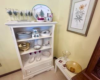 Pretty white bookshelf with drawers.