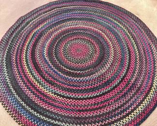 One of two large braided rag rugs.