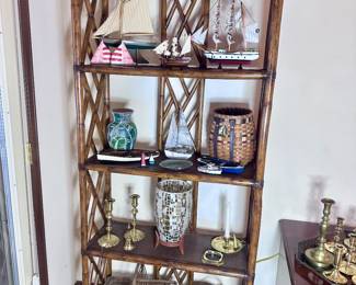 Rattan shelving unit filled with decor.