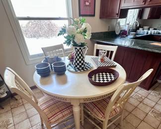 Round table and 4 chairs, extra leaf also.