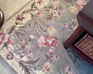 Wool floral rug.