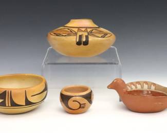 Four pieces of 20th century Native American Earthenware.  Includes a jar, two bowls and a bird form trinket dish with geometric polychrome decoration.  Small bowl partially signed "Frieda…" and bird dish "Trujillo".  Some wear to decoration and surface.  Up to 5 1/2" diameter.  