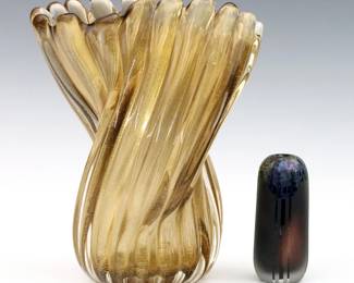 Two mid to late 20th century Art Glass vases.  Includes a 1950's Murano swirled vase with infused gold leaf attributed to Archimede Seguso's "Ritorto a Coste" line, and a 1980's Iridescent Blue bud vase with frosted decoration.  Blue vase initialed "SVL" and dated "81".  Minor surface wear.  Up to 8 3/4" high.  
