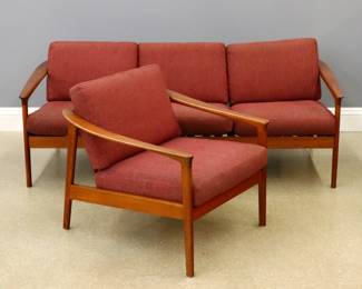 A Mid Mod Folke Ohlsson for Bodafors "Colorado" model sofa and armchair.  Teak frames with vertical back slats, open arms and original lift-off cushions.  Both marked "Bodafors / Design Folke Ohlsson / Made in Sweden".  Original finish with minor wear, cushions with minor fading.  Sofa is 75 x 30 1/2 x 24" high overall, chair is 28 x 30 x 24" high overall.