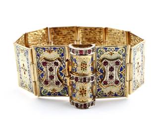 A late 19th century Victorian Period 14k Gold "Book" bracelet.  Features floral enameled segments that fold into a "book" with Red gemstone accents, either Spinel or Red Topaz.  Unmarked, tested 14k.  53.2 grams total.  Minor surface wear and losses to enamel, one loose hinge, may have originally had alternating gemstone chips at "spine".  Approx. 6 3/4" interior diameter, 7 3/4" long open. 