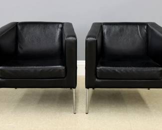 A pair of vintage IKEA "Klappsta" model club chairs designed by Marianne and Knut Hagberg.  Squared design with Black leather upholstery supported by Chrome frames with tapered legs.  Each with original IKEA labels at underside, one with "1999" date.  Chrome with minor oxidation.  Each 29 3/4 x 27 x 28" high overall.