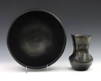 Two pieces of 20th century Native American Earthenware, liekly Santa Clara or San Ildefonso Pueblo.  Includes an undecorated bowl and a vase by Peggy Tafoya with Black glaze.  Vase signed "Peggy Tafoya / Santa Clara Pueblo" at underside.  Some surface wear.  Up to 10 3/4" diameter and 6 1/2" high.  
