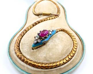 A 19th century Victorian Period 14k Gold snake form necklace with Tourmaline and Diamonds.  14k Gold snake chain with head form clasp featuring a bezel set Purple/Pink Tourmaline cabochon, approx. 10 x 14 mm, surrounded by bezel set round cut Diamond accents, measuring up to approx. 3.75 mm, with Tourmaline eyes and Blue enameled detail.  Presented in a fitted "Poile & Smith" case.  Unmarked, head and chain tested 14k, clasp tongue tested Gold Filled.  43.9 grams total.  Small hole to Gold at underside of head, Tourmaline with inclusions, some wear to surface and enamel.  16 1/2" long open.