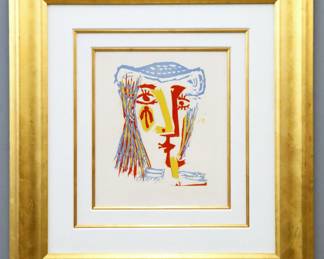 Pablo Picasso, Spanish, 1881-1973.  A linocut in colors on Arches paper, titled "Femme au Chapeau de Paille Bleue" (Baer 1282), from the Marina Picasso Collection, one of approximately 87 impressions.  Stamped "Succ. Pablo Picasso / Coll. Marina Picasso" verso.  Plexi with scratches, not examined out of frame.  Image 14 1/2 x 17" high, in a Gilded wood frame, 33 1/2 x 36" high overall.  ESTIMATE $6,000-8,000