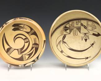 Two 20th century Native American Earthenware bowls, likely Hopi.  Low tapered forms with Brown decoration and matte buff glaze.  Some wear to decoration, one with flake at body.  Up to 9 1/4" diameter x 3 3/4" high overall.