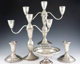 Five pieces of American weighted Sterling Silver.  Includes a pair of Duchin convertible three-light candelabra, a pair of Towle low candlesticks and a Webster compote.  Each marked "Sterling".  Some wear and denting, one low candlestick with damage.  Up to 9 3/4" high.  
