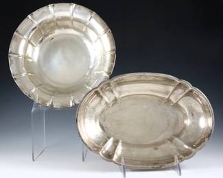 Two American Sterling Silver bowls.  Circular and ovoid forms with scalloped bodies.  Each marked "Sterling".  20.24 troy ozs total.  Some surface wear.  8 3/4" diameter and 9 3/4" long.  
