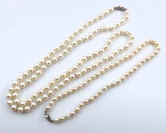 Two Pearl necklaces with 14k White Gold clasps.  Pearls approx. 6.5 mm and 7.75 mm each.  Each marked "14k".  82.2 grams total.  Minor surface wear.  Up to 33" long open.