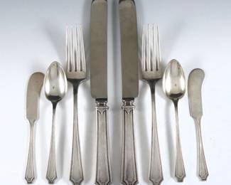 Sixty-two pieces of Whiting "King Albert" pattern Sterling Silver flatware.  Features 12 four-piece place settings plus additional flatware and serving utensils.  Includes 12 x 9 1/2" hollow handle spreader knives, 15 x 5 3/8" butter knives, 12 x 7 3/4" dinner forks, 12 x 5 7/8" teaspoons, plus 11 serving utensils.  Each with impressed Whiting maker's marks and "Sterling".  52.16 troy ozs plus 15 hollow handles, approx. 60.13 total.  Some wear.  
