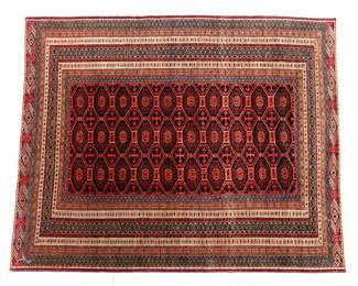 A 4.4' x 5.3' Bokhara Tribal rug.  Multi-color geometric design on a Red field with three rows of central medallions and multiple geometric borders.  Minor wear, some losses to fringe and minor pulls to binding.
