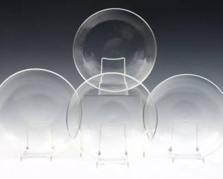 Four 20th century Steuben Crystal low bowls.  Each signed "Steuben".  Some surface wear and scratches.  11" diameter.  
