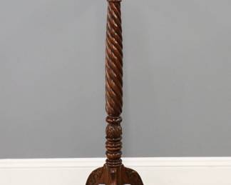 A reproduction display pedestal.  Mahogany construction with circular top over a barley twist stem on a tripod base with cabriole legs.  Refinished with minor wear.  53" high.