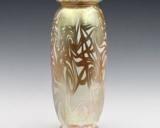 An early 20th century Art Glass vase attributed to Durand.  Tapered form with flared rim and foot with Iridescent Gold "King Tut" pulled decoration.  Drilled for use as lamp, minor surface wear.  12 3/4" high.  
