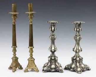 Two pairs of late 19th to early 20th century candlesticks.  Includes a pair of Silverplate candlesticks with Rococo style design, and a pair of Brass altar sticks with Baroque style design and cast masks of Jesus, Mary and Joseph.  Some surface wear and minor pitting, Brass candlesticks with wear to patina and damage at one knop.  Up to 16" high.  
