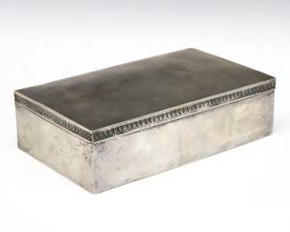 An early 20th century Polish .800 Silver cigar box.  Rectangular hinged box with banded decoration and wood lined interior.  Marked with Polish .800 hallmarks used 1920-1931 and "JS".  Some surface wear and minor distortion, lacks internal divider.  8 1/2 x 5 x 2 1/2" high overall.  
