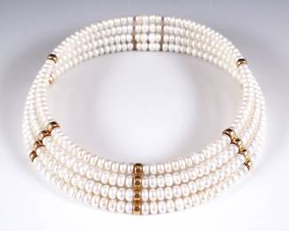 A 14k Gold and Pearl collar necklace.  Features four graduated rows of wired Pearls separated by five rows of 14k Gold spacer beads and two bars.  Gold unmarked, tested 14k.  78.0 grams total.  Adjustable, 4" interior diameter with ends touching.  Some of the spacer beads disconnected, glued repair to some of end beads.