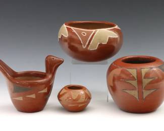 Four pieces of 20th century Native American Earthenware.  Includes a jar by Frances Salazar, a bowl, a bird form bowl and a miniature pot by Juan Tafoya, each with geometric polychrome or carved decoration.  Jar signed "Frances Salazar / Santa Clara" and small pot "Juan Tafoya / San Ildefonso 1983" at undersides.  Some crazing and wear to decoration.  Up to 4" high.  
