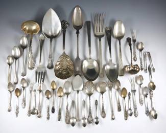 Forty-one pieces Sterling Silver flatware.  Includes serving utensils, flatware, souvenir spoons and others.  Each marked "Sterling" or "925".  34.76 troy ozs total.  Some wear and minor damage, many monogrammed.  Up to 10 1/2" long.  
