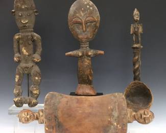 Four vintage African carved wood pieces.  Includes an Akua'ba fertility doll, a female fetish figure, a figural headrest and spoon.  Wear and some damage.  Up to 19" long and 17 3/4" high.  
